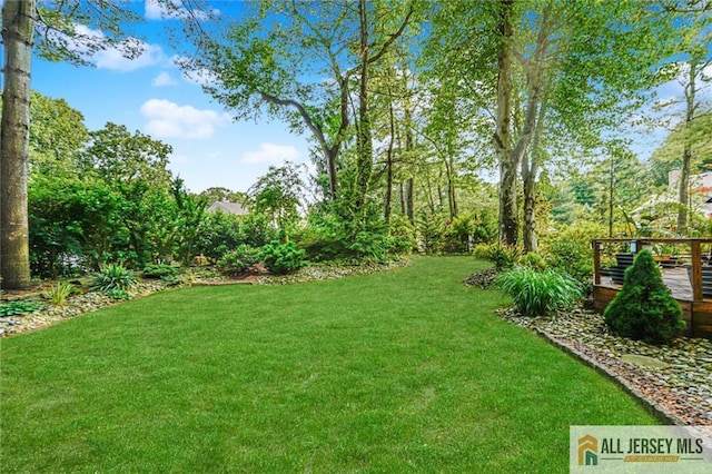 5 Leighton Dr, East Brunswick, NJ 08816 - view of grassy yard with a wooden deck