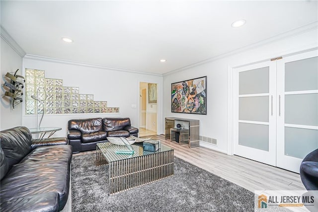 5 Leighton Dr, East Brunswick, NJ 08816 - living area featuring ornamental molding, wood finished floors, and recessed lighting