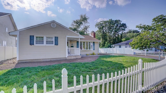 230 Raritan St, South Amboy, NJ 08879 - view of front of home with a fenced backyard and a chimney
