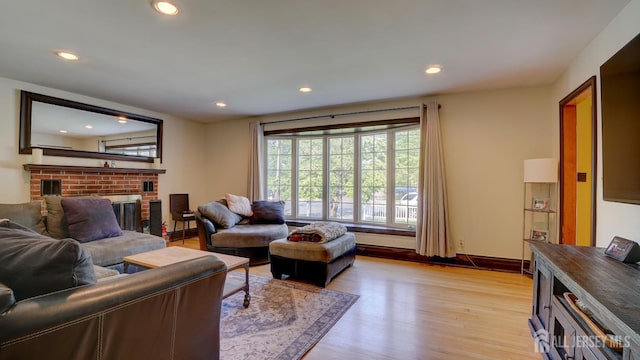 230 Raritan St, South Amboy, NJ 08879 - living area with light wood-style floors, recessed lighting, and a fireplace