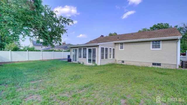 230 Raritan St, South Amboy, NJ 08879 - rear view of house with a sunroom and a fenced backyard