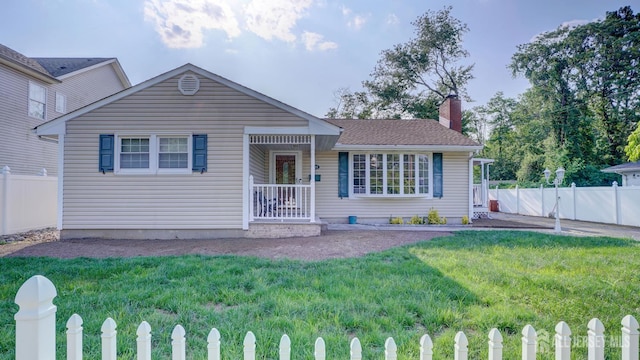 230 Raritan St, South Amboy, NJ 08879 - view of front of house featuring a chimney and a fenced front yard