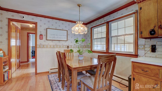 230 Raritan St, South Amboy, NJ 08879 - dining space featuring a baseboard heating unit, wallpapered walls, light wood-type flooring, ornamental molding, and a chandelier