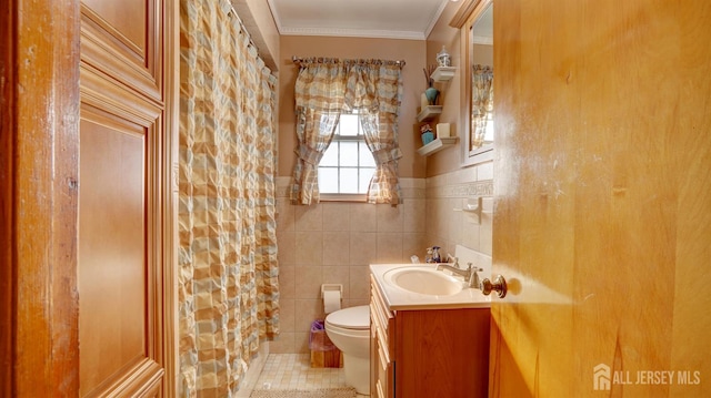 230 Raritan St, South Amboy, NJ 08879 - full bathroom with vanity, tile patterned flooring, tile walls, crown molding, and a wainscoted wall