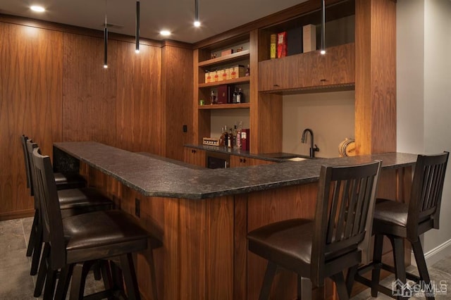 bar featuring sink and built in shelves