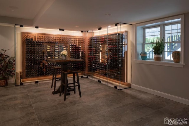 wine area featuring tile patterned floors