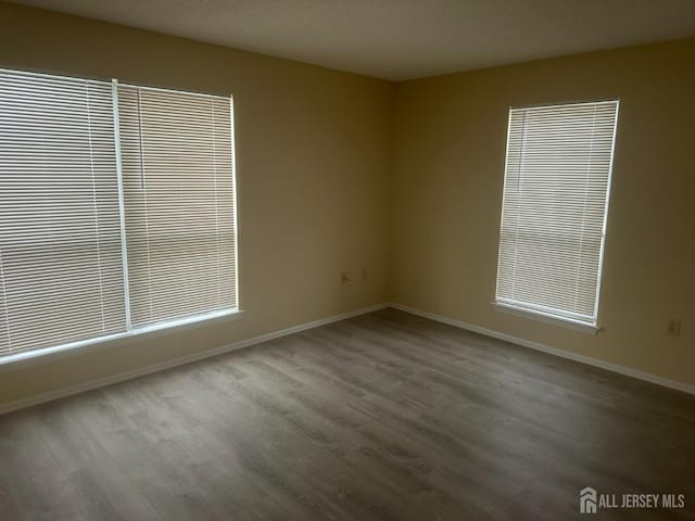 unfurnished room featuring hardwood / wood-style floors