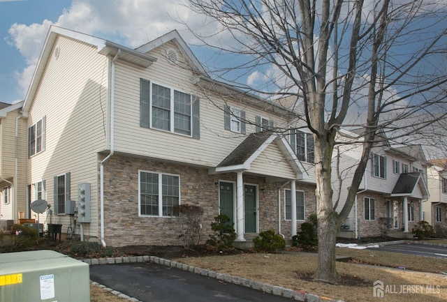 view of front of house with stone siding