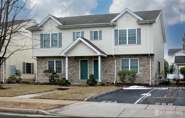 view of front of home featuring stone siding