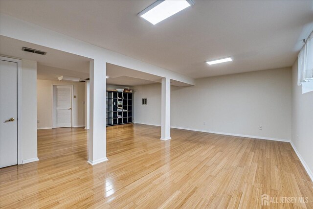 basement with light wood-type flooring