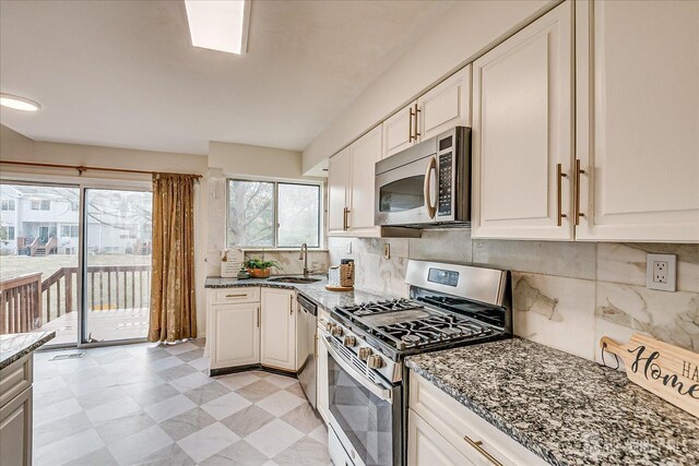 kitchen with white cabinets, sink, and stainless steel appliances