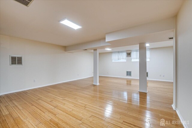 basement featuring light hardwood / wood-style floors