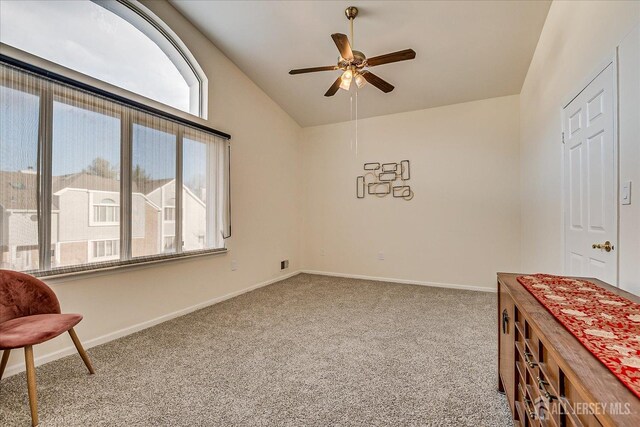 interior space featuring lofted ceiling and ceiling fan