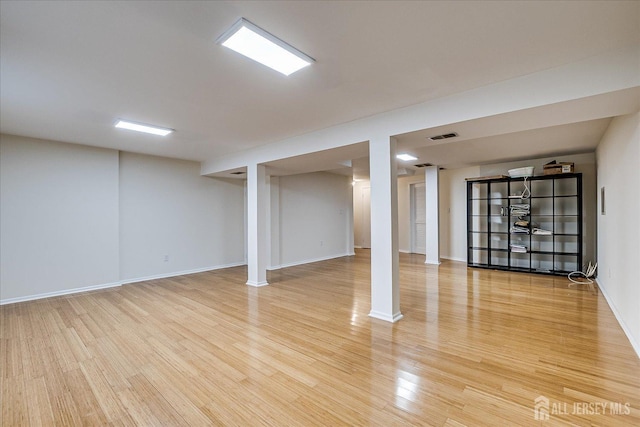 basement with wood-type flooring