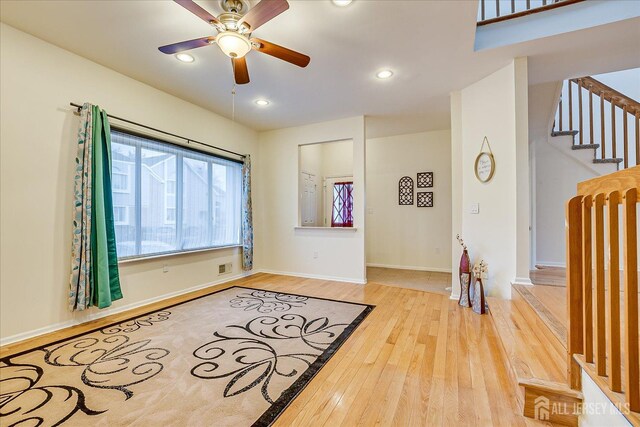 interior space featuring ceiling fan and hardwood / wood-style floors