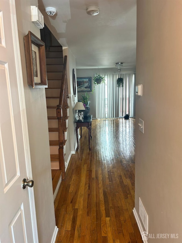 741 Bound Brook Rd, Dunellen, NJ 08812 - hallway featuring wood-type flooring and stairs