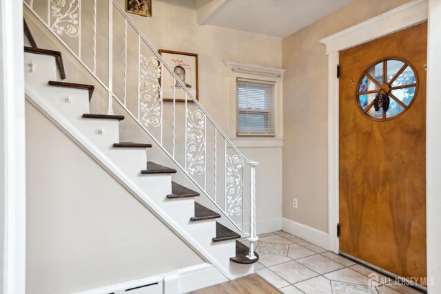 113 Coleman St, Middlesex, NJ 08846 - tiled entryway with baseboard heating and stairway