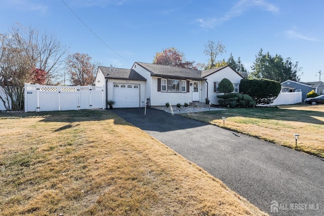 single story home with a garage and a front yard