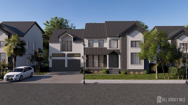 view of front of property featuring stucco siding, a front lawn, driveway, and a balcony