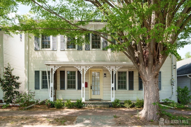 colonial house featuring covered porch