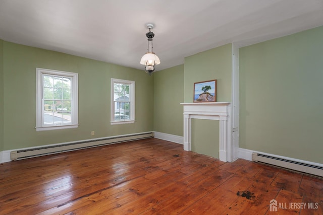 unfurnished living room featuring wood-type flooring, baseboards, and baseboard heating