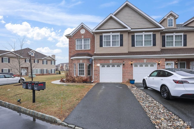 view of property with a garage and a front yard