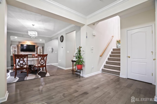 dining area with dark hardwood / wood-style flooring, crown molding, and a chandelier