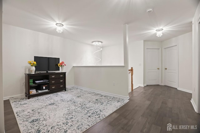 interior space featuring a chandelier and dark hardwood / wood-style flooring