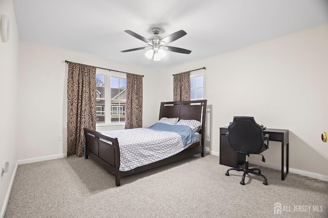 bedroom with multiple windows, ceiling fan, and carpet flooring