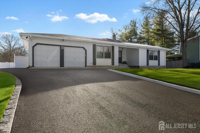 ranch-style house with a front lawn and a garage