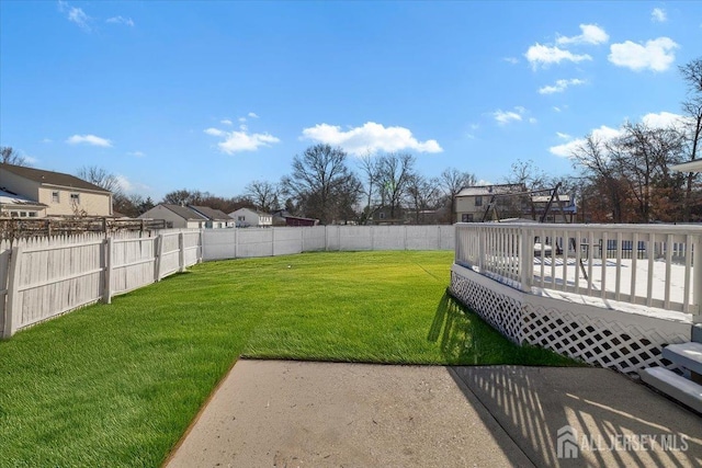 view of yard with a wooden deck