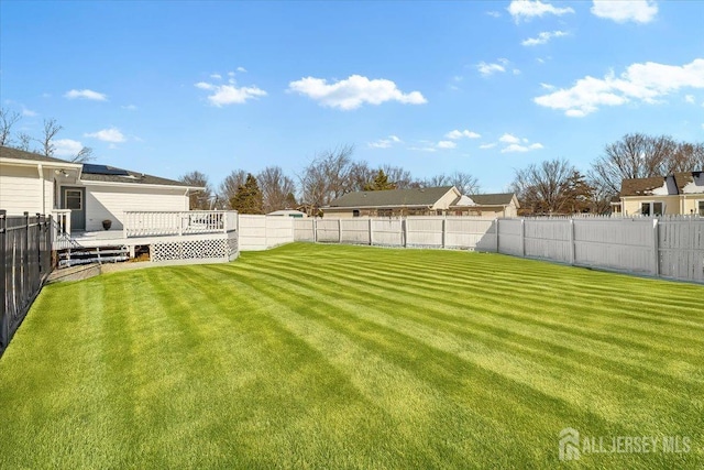 view of yard with a wooden deck