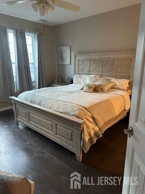 138 N Grabowski Dr Unit 1490, Sayreville, NJ 08859 - bedroom with dark wood-style flooring and a ceiling fan