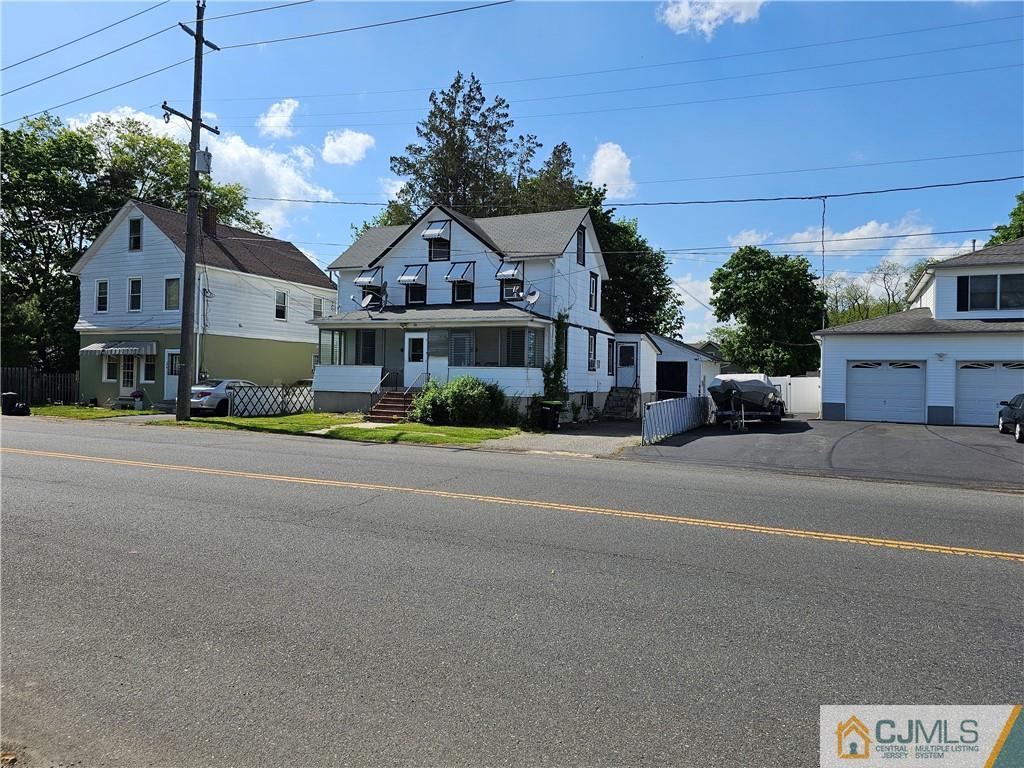 view of front of home with an outbuilding and a garage