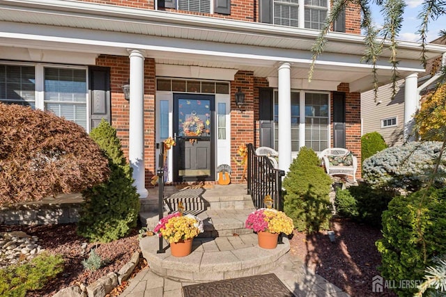 doorway to property with a porch