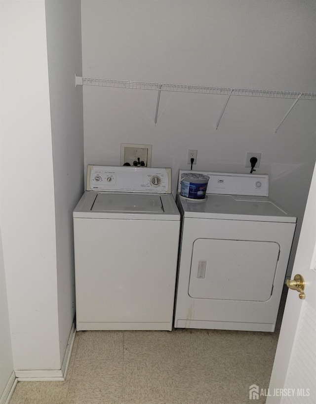 laundry area featuring washing machine and clothes dryer