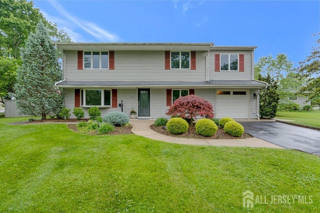 16 Russet Rd, South Brunswick, NJ 08824 - traditional home with asphalt driveway, a garage, and a front yard