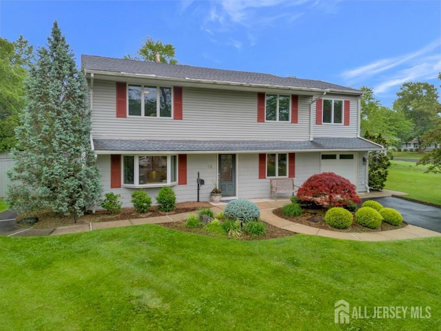 16 Russet Rd, South Brunswick, NJ 08824 - traditional home featuring a garage, a front yard, asphalt driveway, and a shingled roof