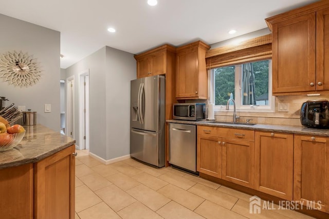 16 Russet Rd, South Brunswick, NJ 08824 - kitchen featuring stainless steel appliances, brown cabinetry, decorative backsplash, light tile patterned flooring, and recessed lighting