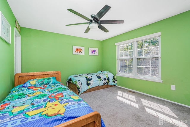 bedroom featuring baseboards, carpet, a ceiling fan, and visible vents