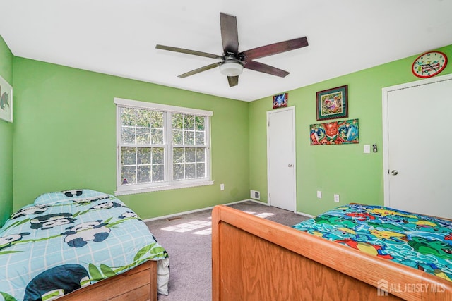 bedroom featuring baseboards, ceiling fan, carpet, and visible vents