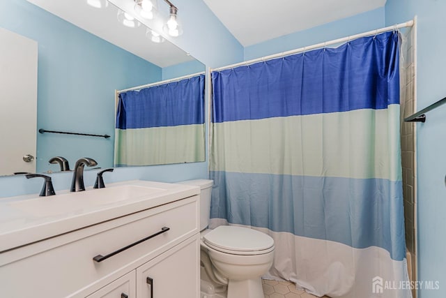 full bath featuring vanity, tile patterned flooring, toilet, and a shower with curtain