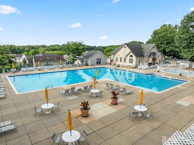 1301 Cypress Ln, East Brunswick, NJ 08816 - community pool with a patio and view of wooded area