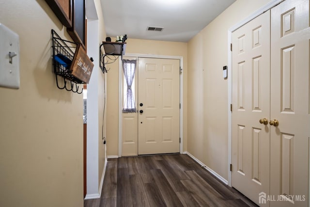 1301 Cypress Ln, East Brunswick, NJ 08816 - doorway with dark wood finished floors and baseboards