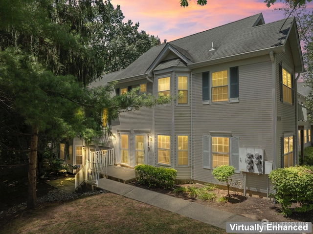 1301 Cypress Ln, East Brunswick, NJ 08816 - back of property at dusk with a shingled roof