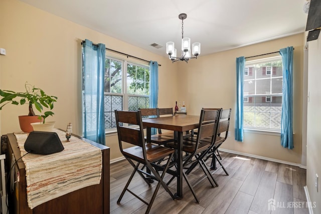 1301 Cypress Ln, East Brunswick, NJ 08816 - dining room featuring a chandelier and wood finished floors