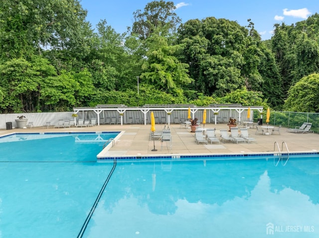 1301 Cypress Ln, East Brunswick, NJ 08816 - community pool with a patio area and view of wooded area