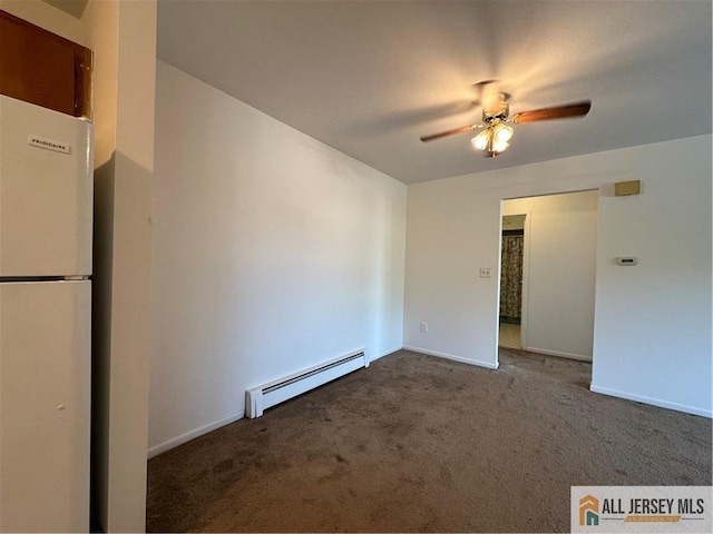 unfurnished room featuring baseboard heating, ceiling fan, carpet, and baseboards
