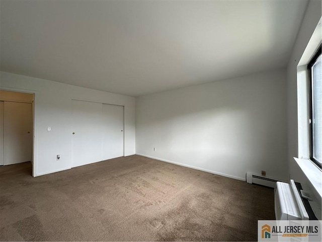 414 Cricket Ln Unit 414, Woodbridge Proper, NJ 07095 - unfurnished bedroom featuring carpet floors, multiple windows, a baseboard heating unit, and baseboards