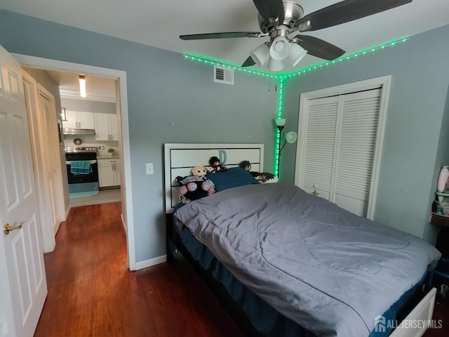 323 Gill Ln Unit 12Q, Iselin, NJ 08830 - bedroom with dark wood finished floors, a closet, and ceiling fan